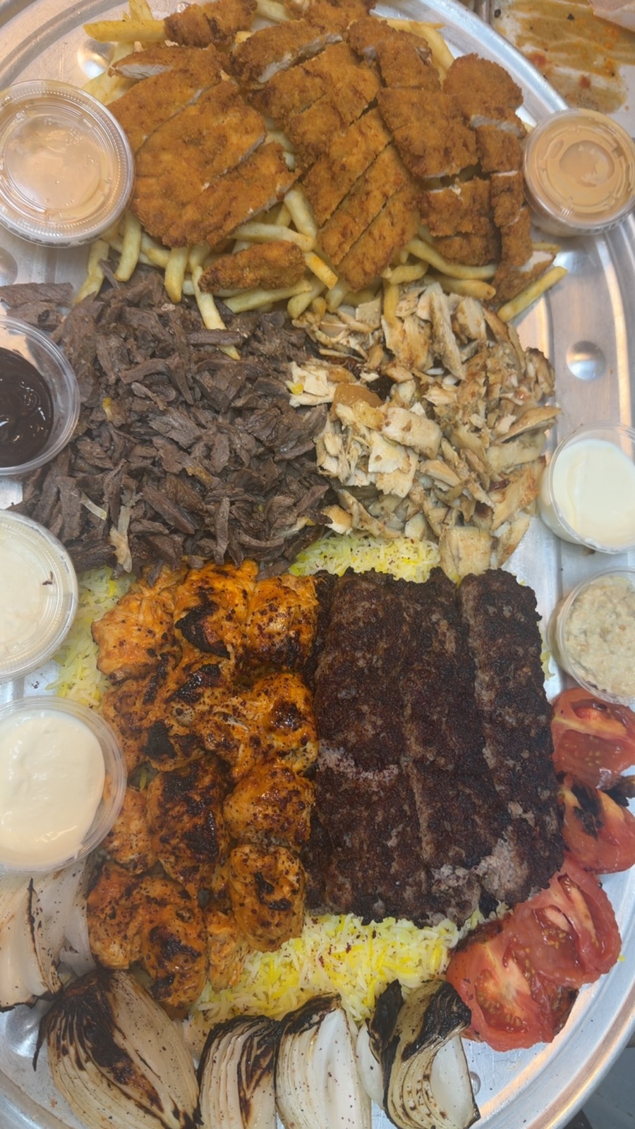 Sinbad mixed platter with kebab, tikka, shawarma, chicken escalope and rice
