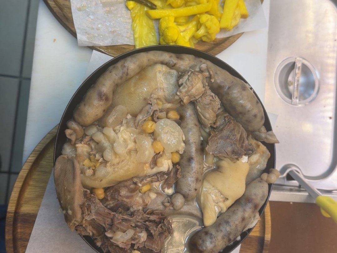 Iraqi pacha bowl with pickles and fresh vegetables